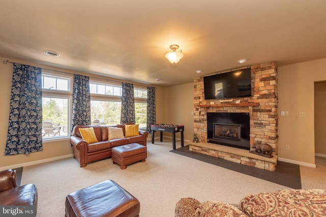 living room with carpet flooring and a fireplace