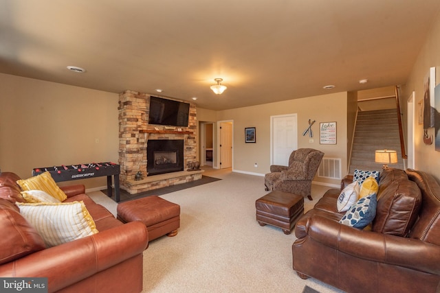 living room with carpet floors and a fireplace