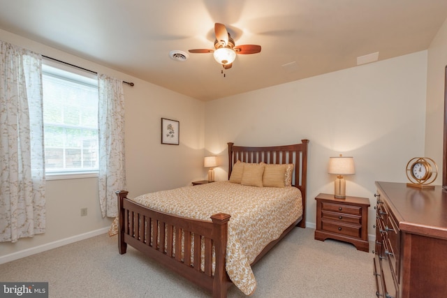 428 Pinnacle Dr, Swanton, MD 21561 - bedroom with visible vents, ceiling fan, light carpet, and baseboards