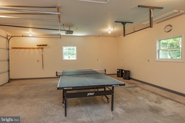 game room with concrete floors and plenty of natural light