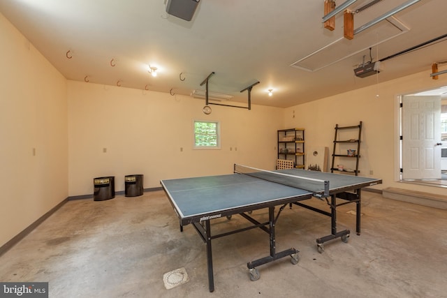 428 Pinnacle Dr, Swanton, MD 21561 - recreation room with attic access, concrete flooring, a garage, and baseboards