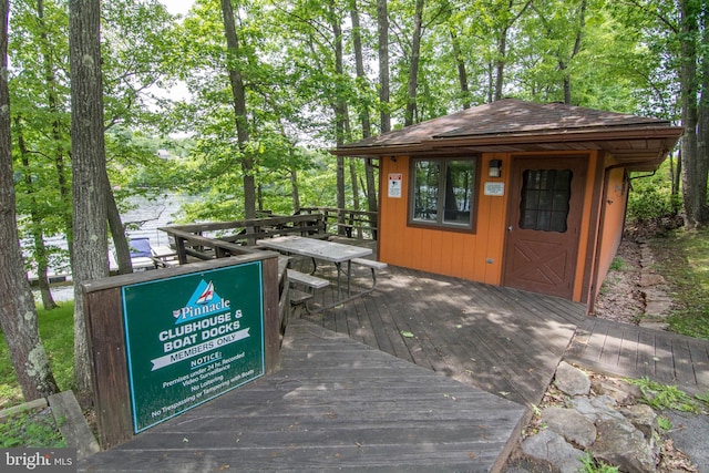 428 Pinnacle Dr, Swanton, MD 21561 - wooden terrace with outdoor dining space and an outbuilding