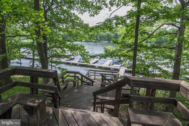 wooden terrace with a water view