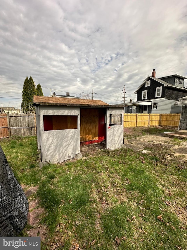 view of shed with fence
