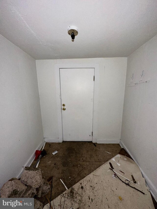 interior space featuring baseboards