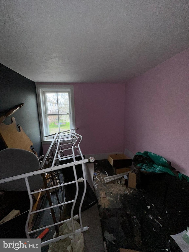 interior space featuring a textured ceiling