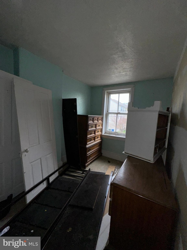 unfurnished bedroom with baseboards