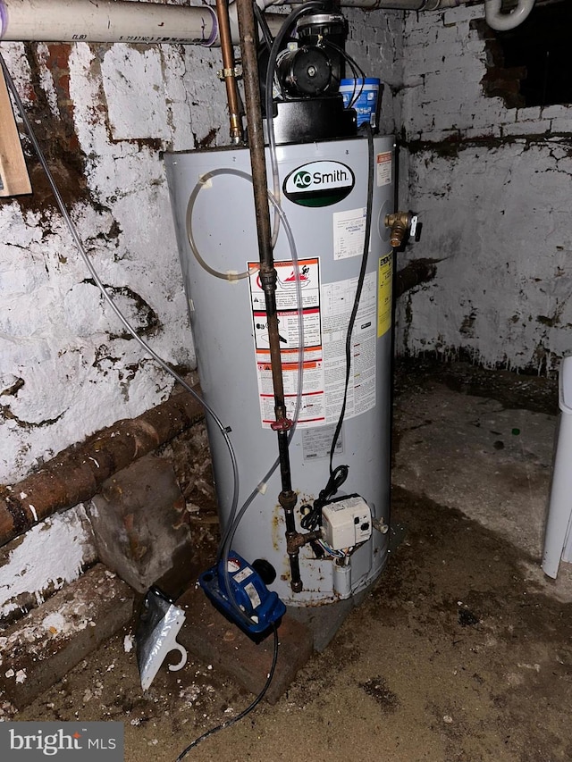 utility room featuring water heater