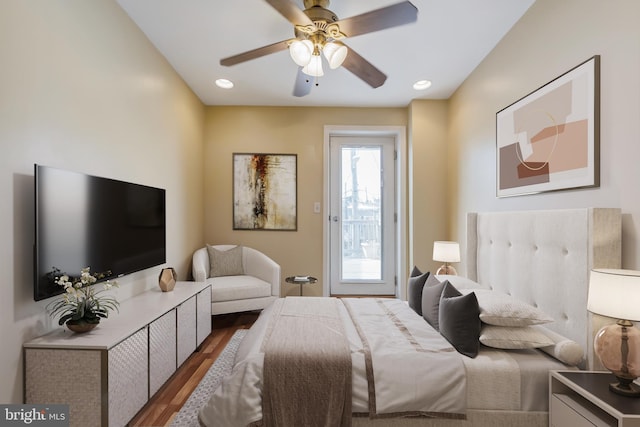 bedroom with ceiling fan and dark hardwood / wood-style flooring