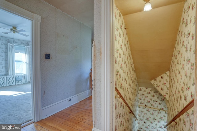 bathroom with hardwood / wood-style floors, ceiling fan, and lofted ceiling