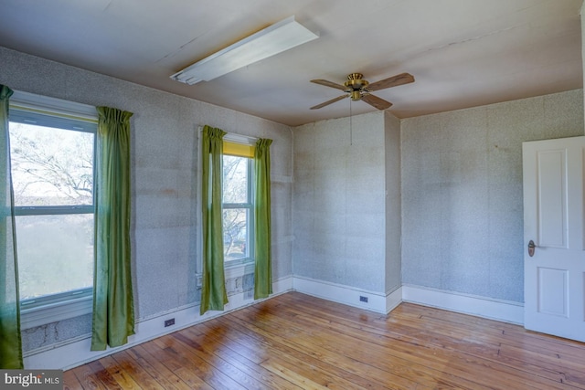 unfurnished room featuring ceiling fan and light hardwood / wood-style floors