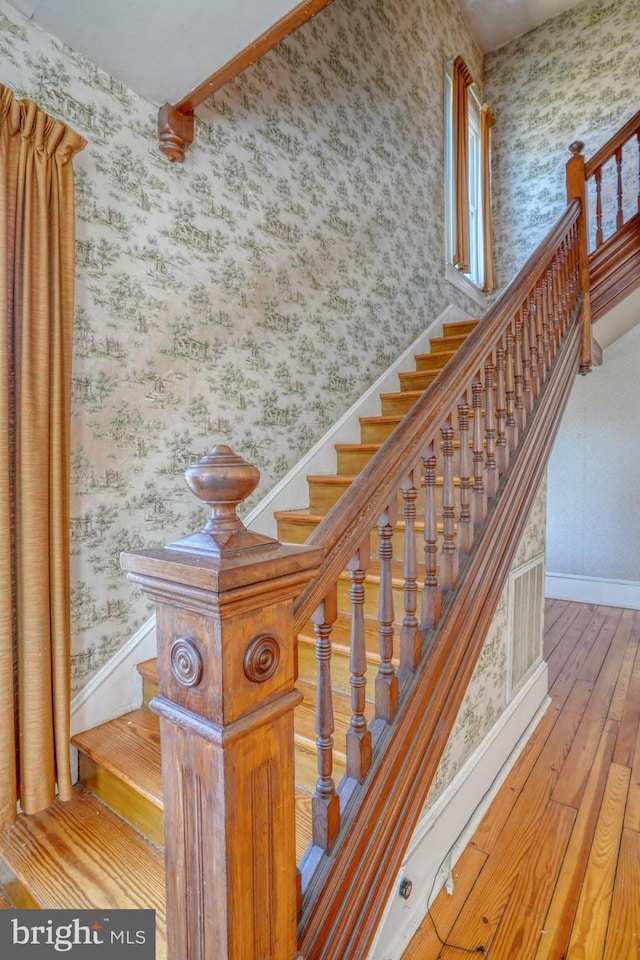 stairway with wood-type flooring