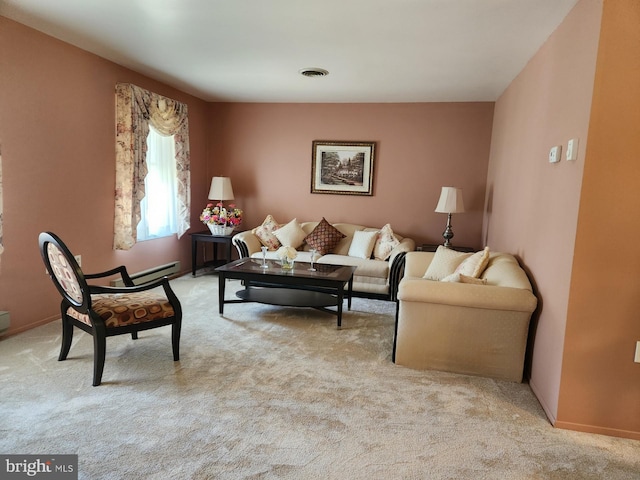 living room featuring light carpet and a baseboard heating unit