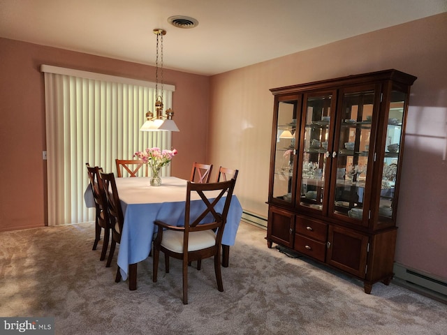 dining space featuring carpet floors and a baseboard radiator