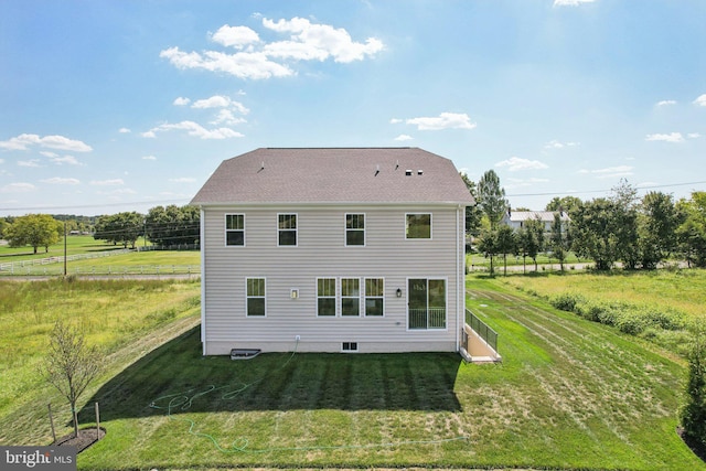 back of house with a yard