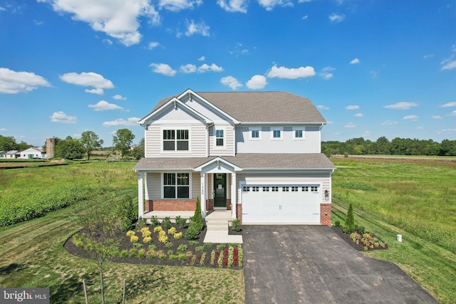 view of front of home featuring a front lawn and a garage