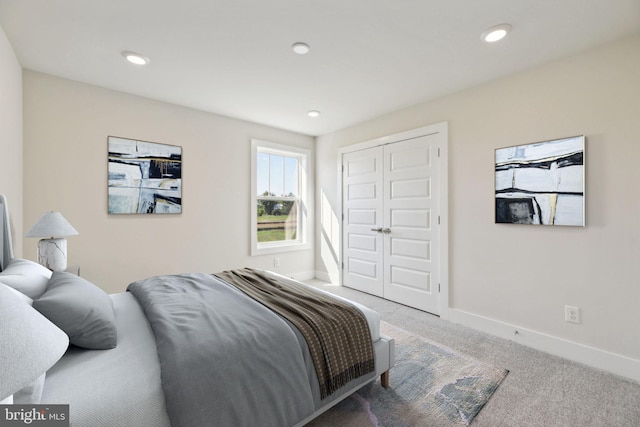 carpeted bedroom featuring a closet