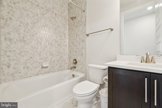 full bathroom with vanity, toilet, and  shower combination