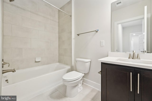 full bathroom with tiled shower / bath, vanity, toilet, and tile patterned flooring