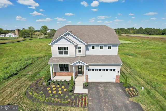 view of front of house with a front lawn and a garage