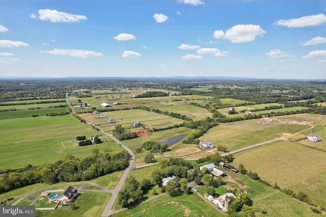 birds eye view of property with a rural view