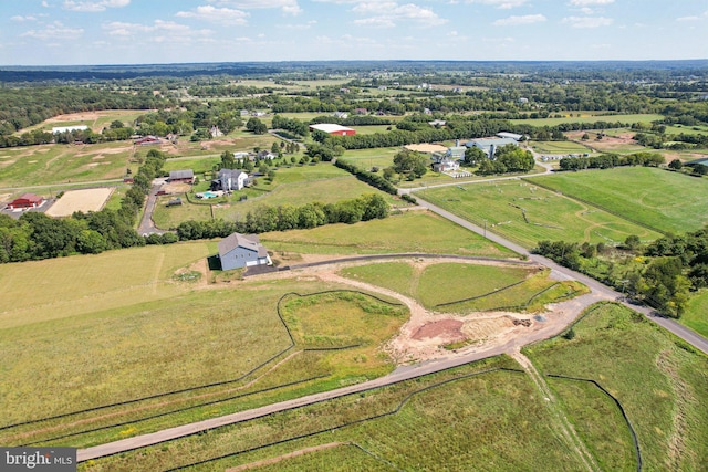 birds eye view of property with a rural view