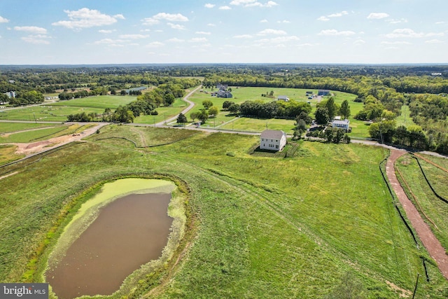 drone / aerial view with a water view and a rural view