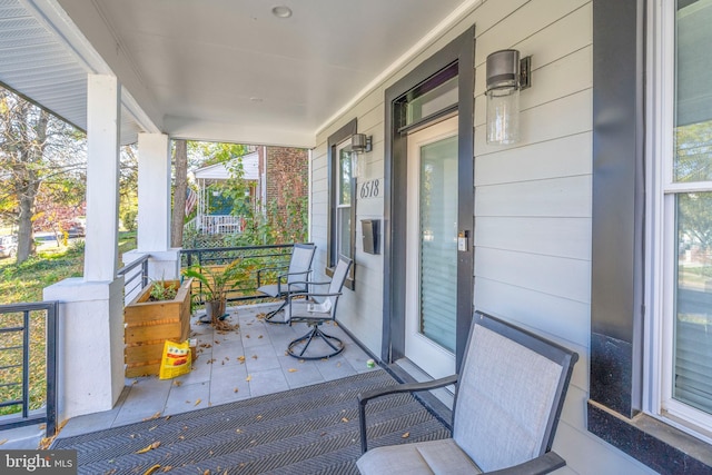 wooden deck featuring covered porch