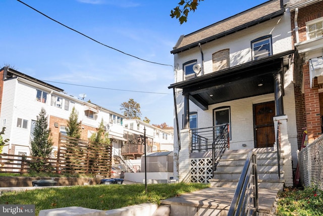 5317 9th St NW, Washington, DC 20011 - townhome / multi-family property featuring covered porch, brick siding, and a residential view