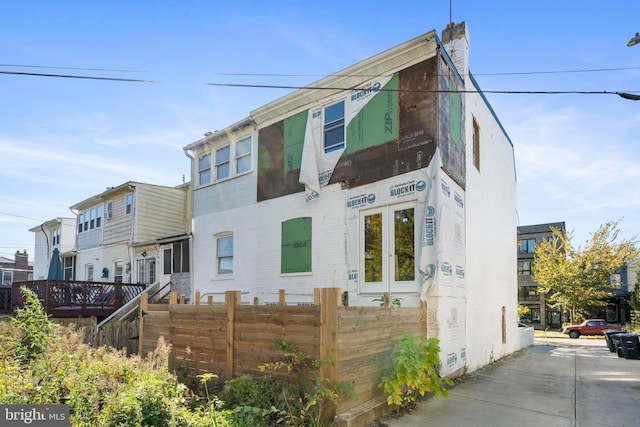 5317 9th St NW, Washington, DC 20011 - view of front facade with fence and a chimney