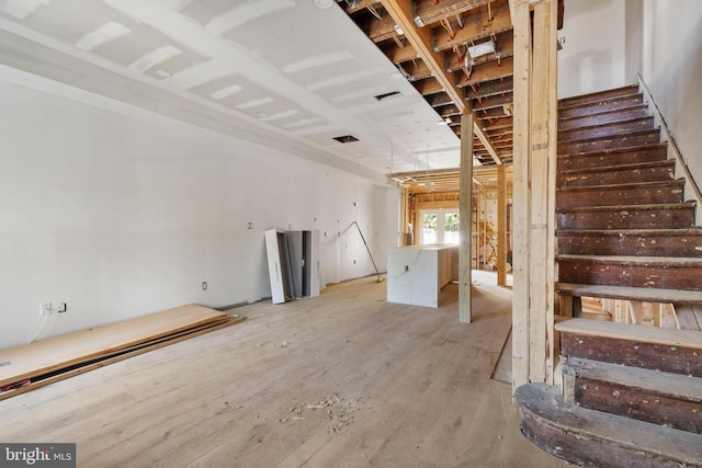 5317 9th St NW, Washington, DC 20011 - unfurnished living room with stairway and hardwood / wood-style flooring