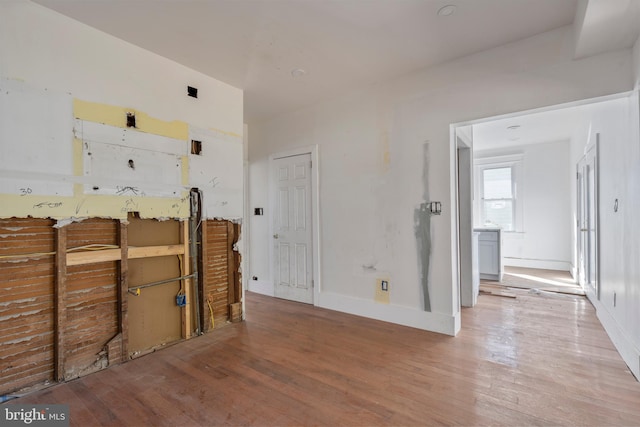 unfurnished bedroom featuring hardwood / wood-style flooring