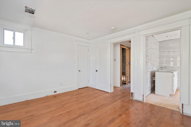 spare room featuring light wood-type flooring