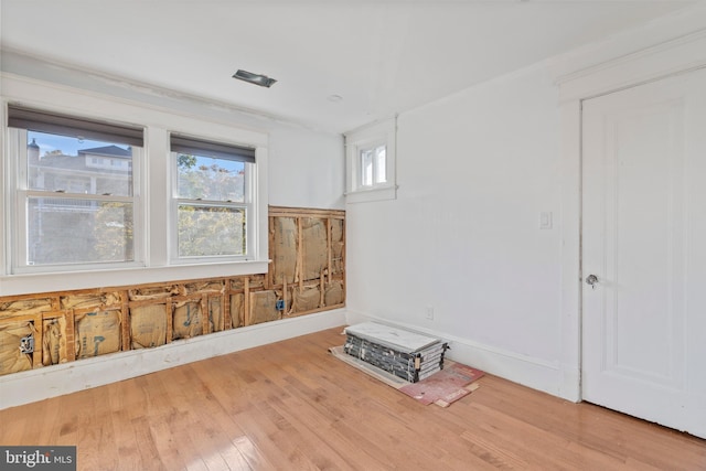 spare room with wood finished floors