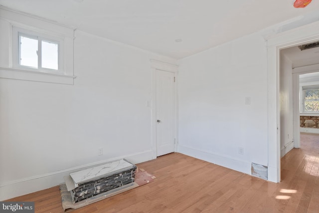 empty room with light hardwood / wood-style floors