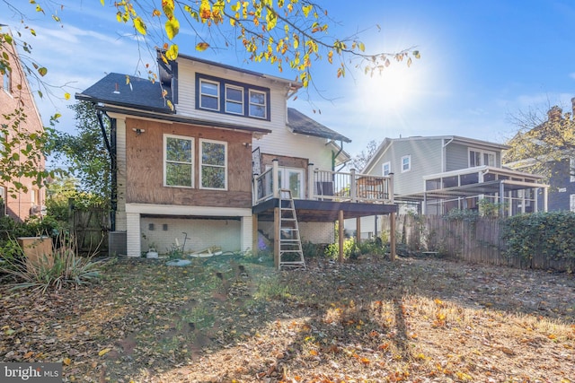 rear view of property with a deck