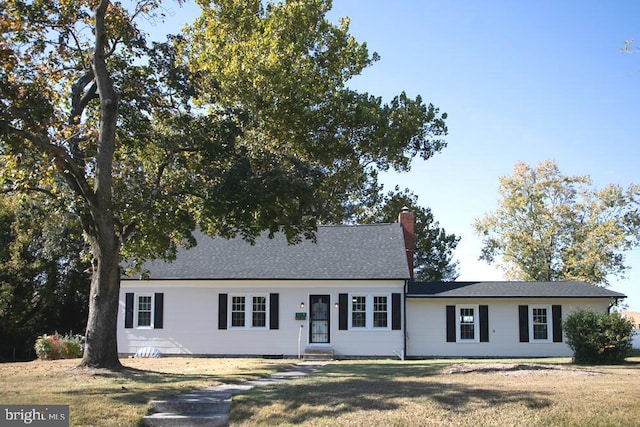 view of front of home with a front yard