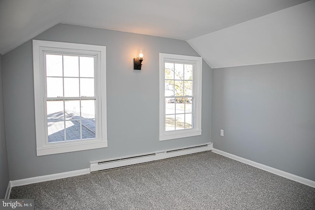 additional living space with carpet flooring, lofted ceiling, and a baseboard heating unit