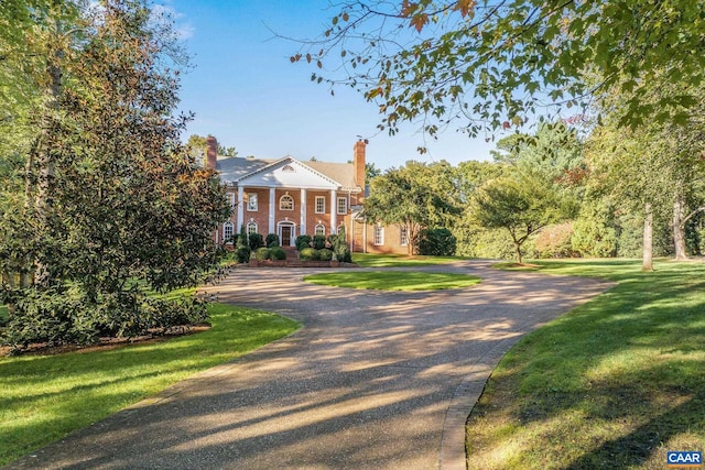 neoclassical / greek revival house with a front yard