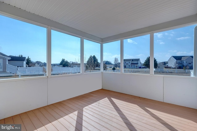 unfurnished sunroom with a wealth of natural light