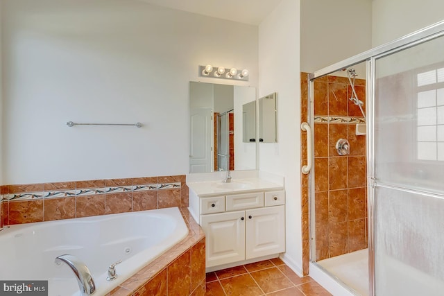 bathroom featuring tile patterned flooring, vanity, and independent shower and bath