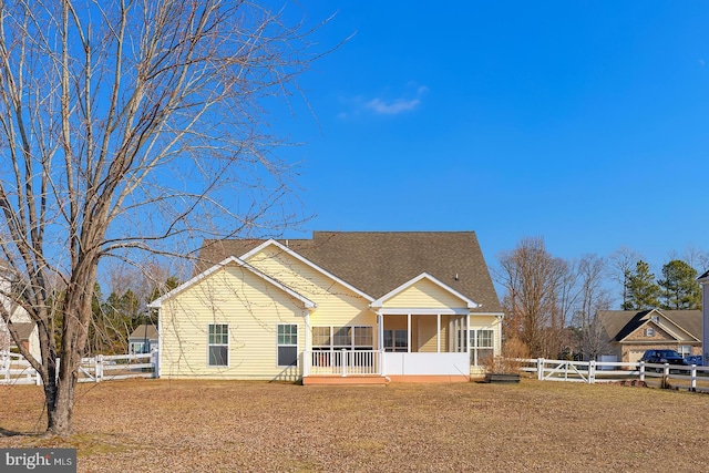 rear view of house with a sunroom