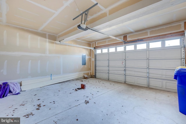 garage featuring a garage door opener and electric panel