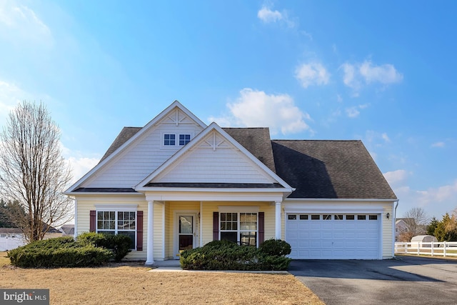 view of front of property featuring a garage and covered porch