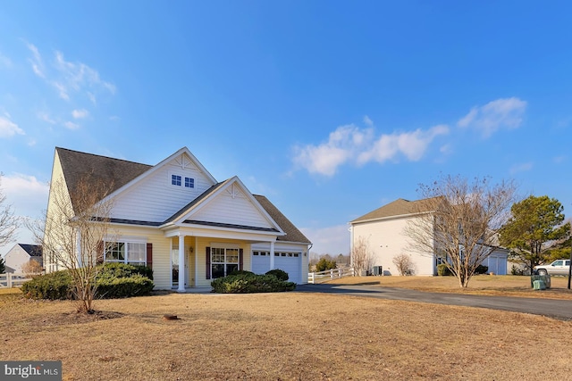 view of front of home with a garage and a front yard