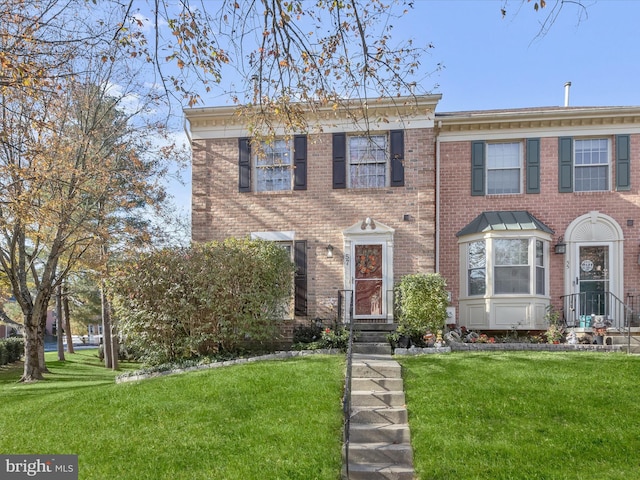 view of front of property with a front lawn