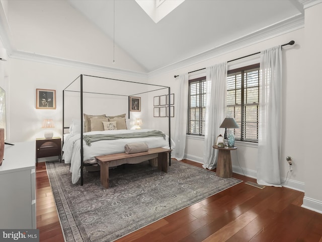 bedroom featuring dark wood-type flooring and lofted ceiling with skylight