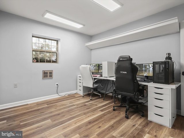 office area with light hardwood / wood-style floors