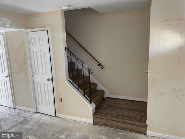 stairs with concrete floors