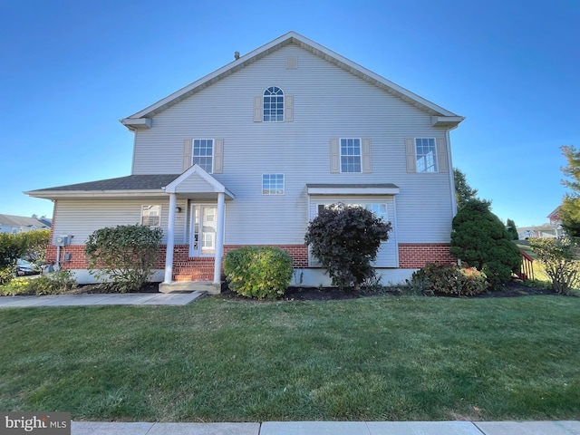 view of property featuring a front yard